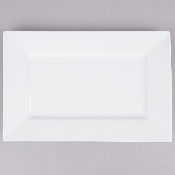 A white rectangular Arcoroc porcelain platter with a white rim.