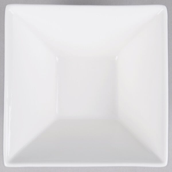 A white square bowl with a flared square center.