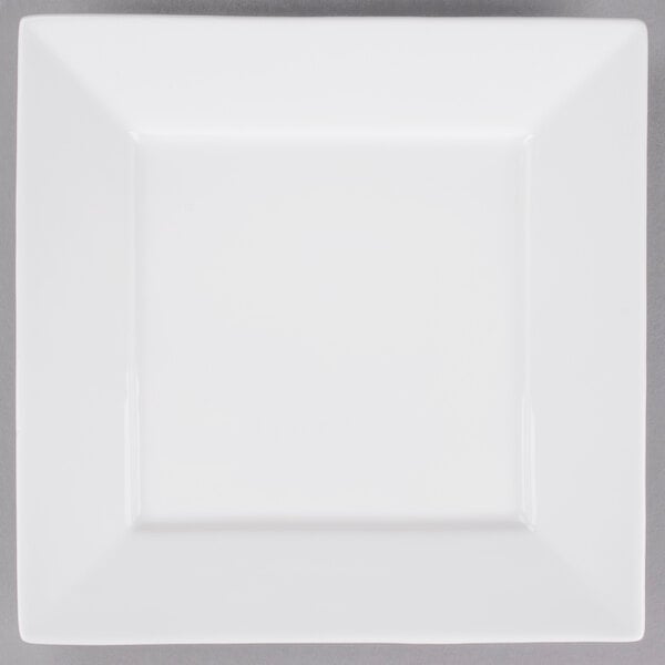 A white square Arcoroc porcelain brunch plate with a small square cut out.