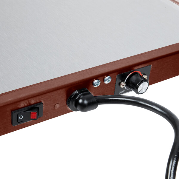 A close up of a Hatco heated shelf warmer switch.