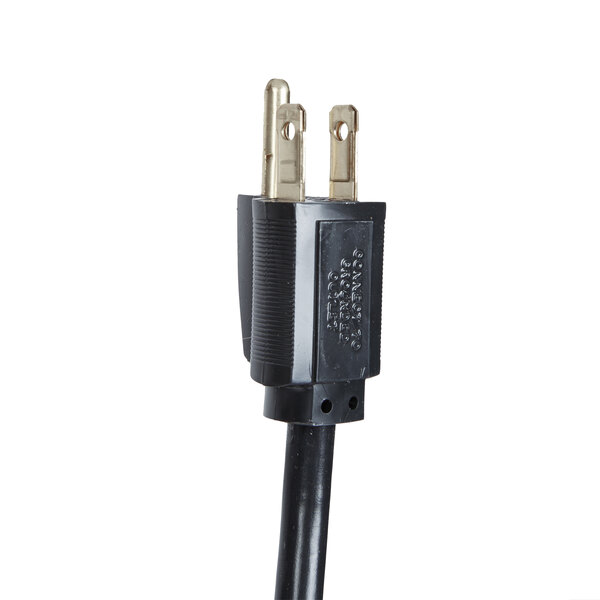 A black power cord with two gold plugs attached to a Hatco Glo-Ray heated shelf warmer.