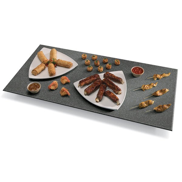 A plate of food on a Hatco heated stone shelf.