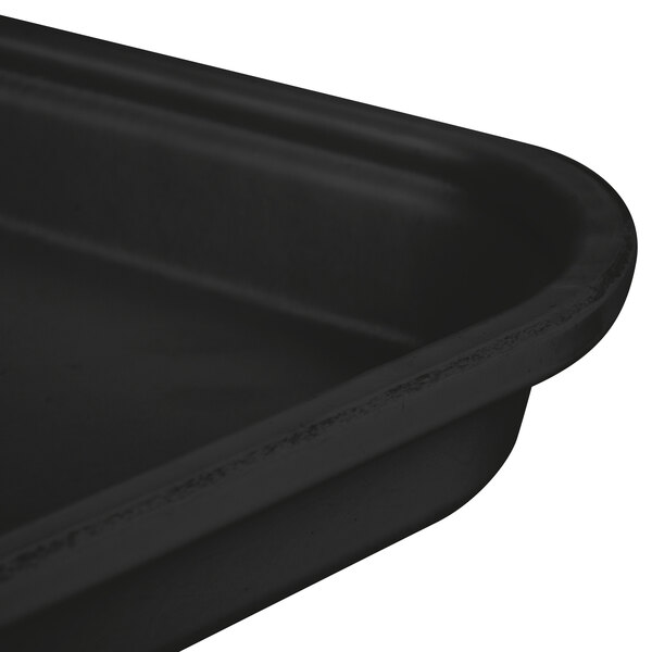 A close-up of a Carlisle black Glasteel bakery display tray.