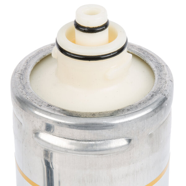 A close-up of a metal cylinder with a white lid.