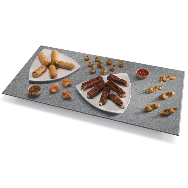 A gray Hatco heated stone shelf with food on a plate.
