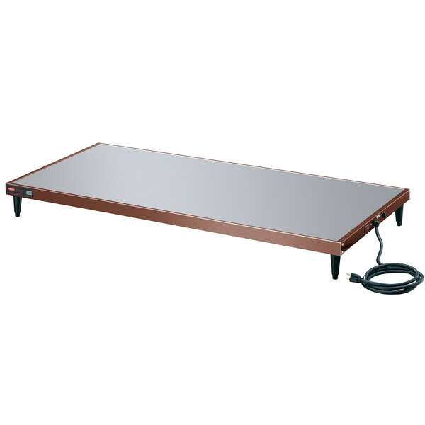 A rectangular metal Hatco heated shelf with a cord.