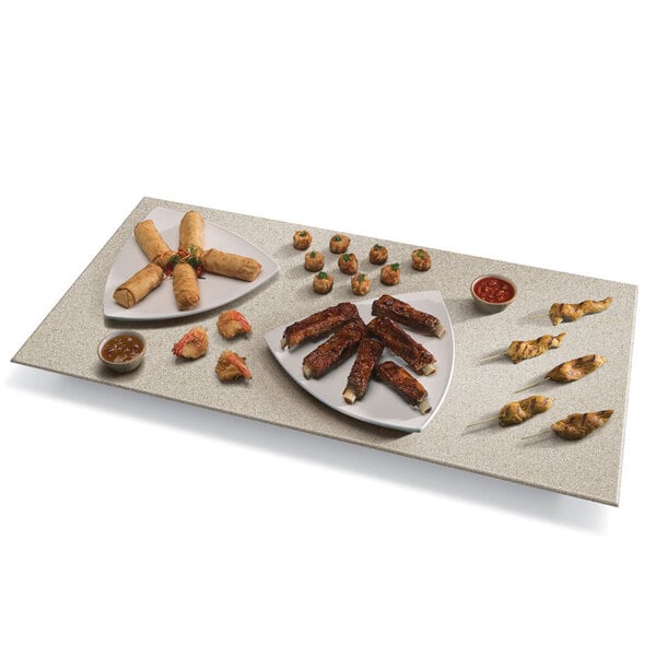 A plate of ribs on a Hatco Bermuda Sand heated stone shelf.