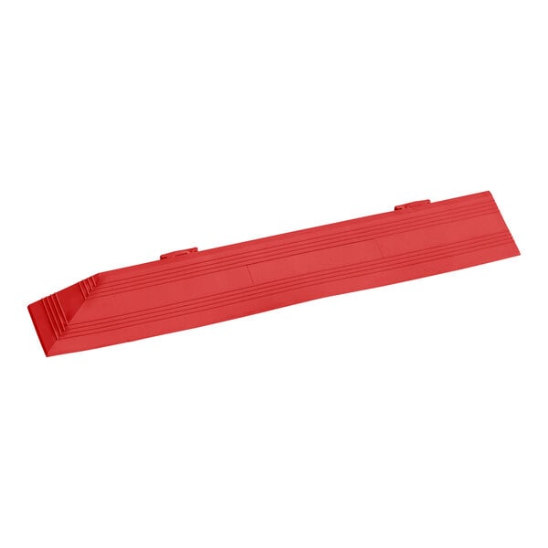 A red vinyl Cactus Mat corner ramp with male end on a white background.