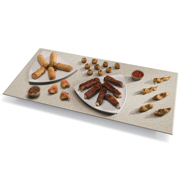 A plate of food on a Hatco Bermuda Sand heated stone shelf.
