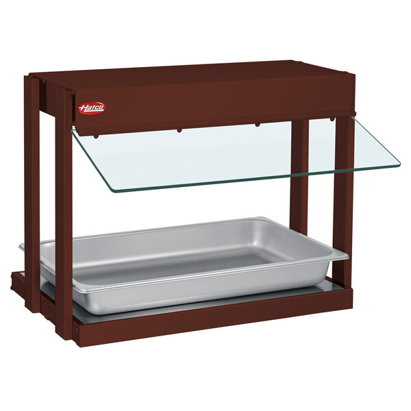 A brown metal Hatco countertop food warmer with a tray.