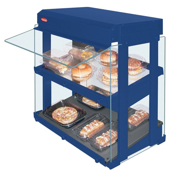 A navy blue Hatco countertop heated display warmer with food on trays.