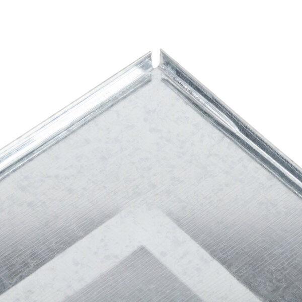 A close-up of a silver metal crumb tray with white and grey accents.