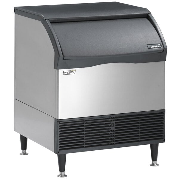 A silver and black Scotsman undercounter ice machine with a lid.