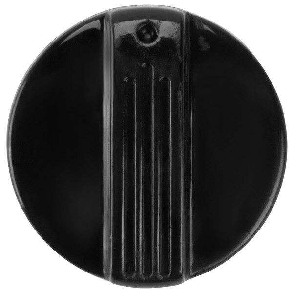 A black round knob with a black stripe on it.