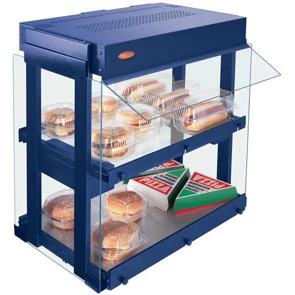 A navy blue Hatco countertop warmer with heated food on shelves.