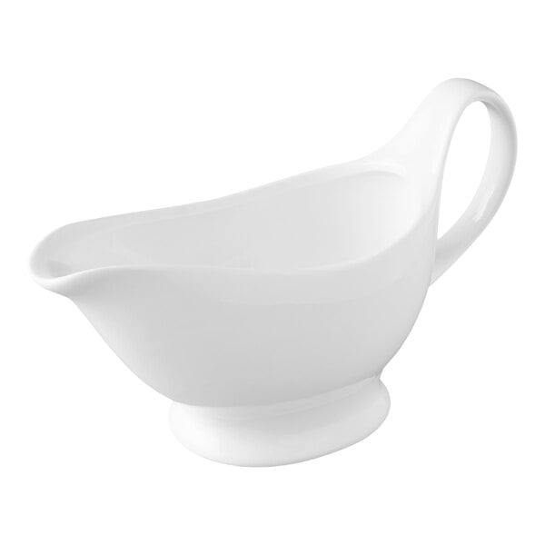 A white porcelain gravy boat with a handle and a spout, shown against a plain background.