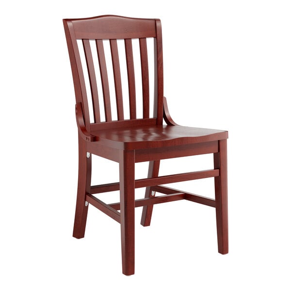 A Lancaster Table & Seating mahogany wood school house chair with a slatted back.