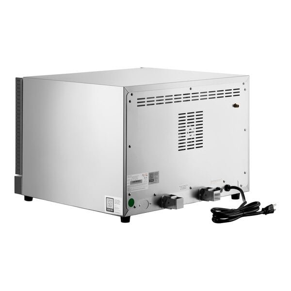 The image shows the back view of a stainless steel countertop appliance with ventilation slots, two control knobs, and a power cord.
