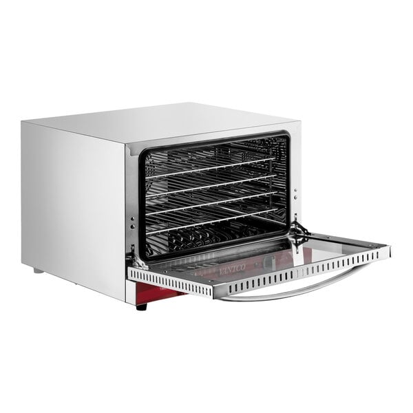 A stainless steel countertop convection oven with a glass door open, revealing multiple wire racks inside.