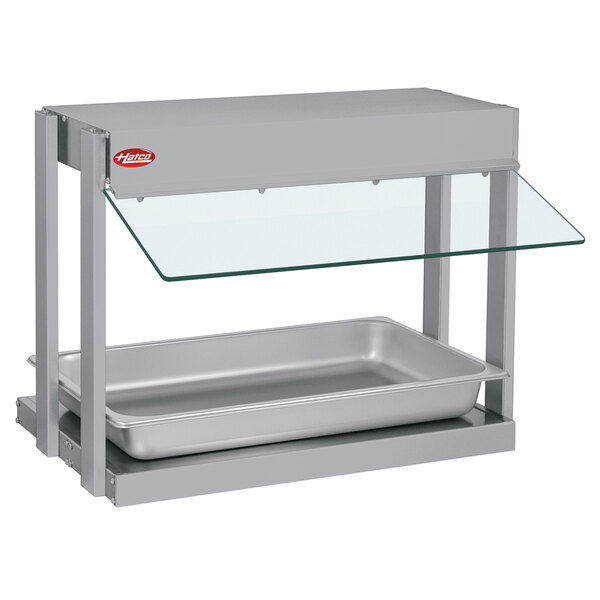 A silver Hatco countertop food warmer with a glass shelf.