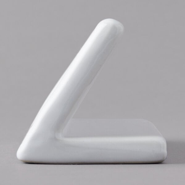 A white rectangular ceramic card sign with curved corners.