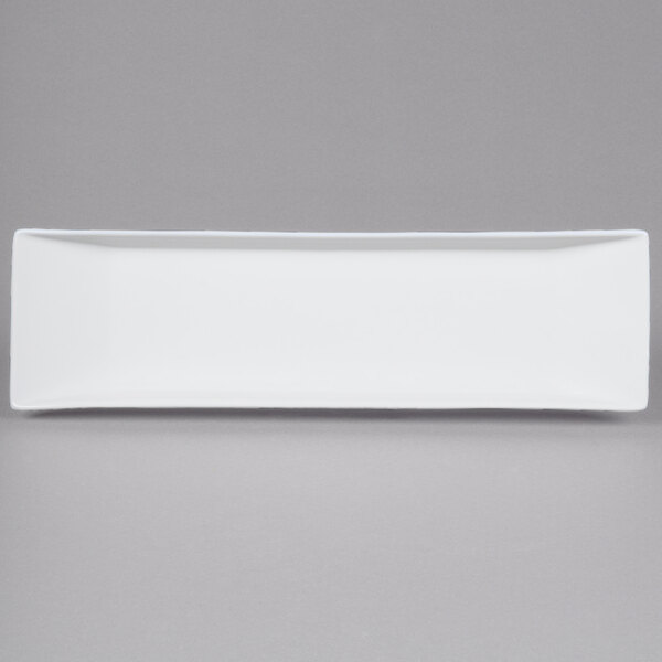 A white rectangular porcelain platter with a black border.