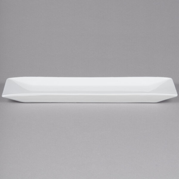 A white rectangular Cal-Mil porcelain platter with a long edge.