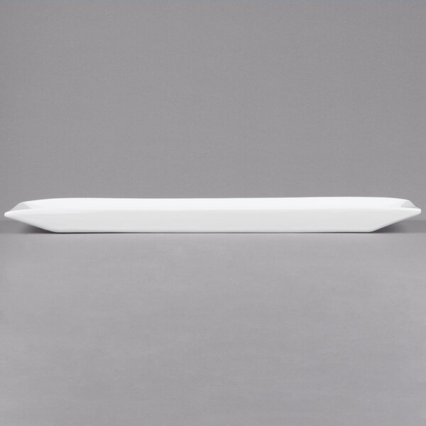 A white rectangular Cal-Mil porcelain platter.