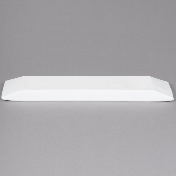 A white rectangular porcelain platter with a black border.