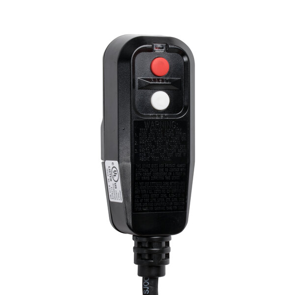 A black rectangular object with a white label with a red button.