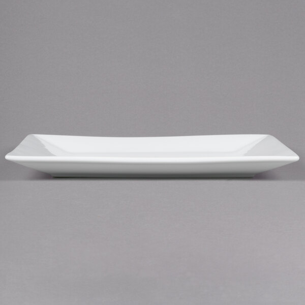 A white rectangular Cal-Mil porcelain platter on a white surface.