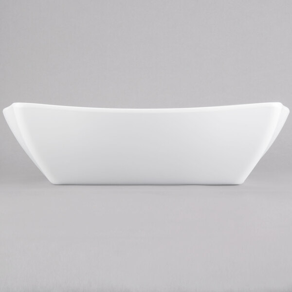 A white rectangular bowl on a gray background.