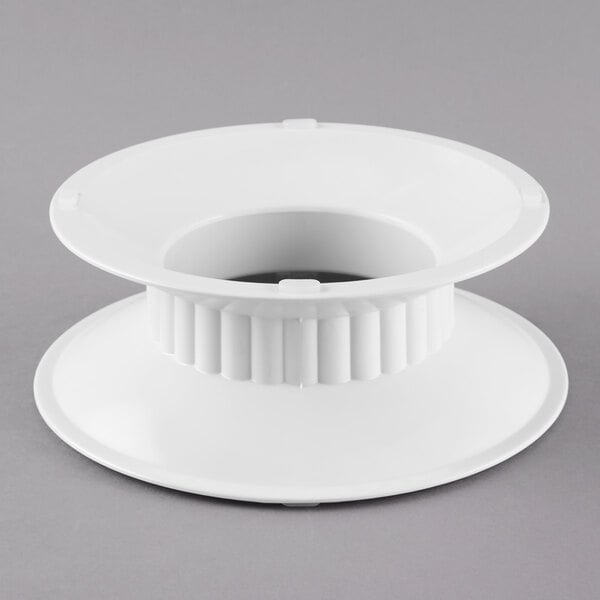 A white melamine pedestal with a hole in the top.