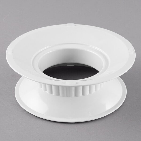 A white melamine pedestal with a hole in the top.