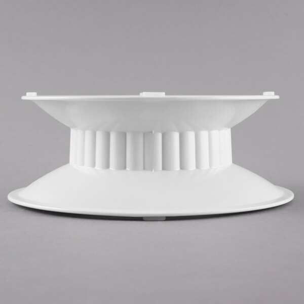 A white melamine pedestal with a round base.