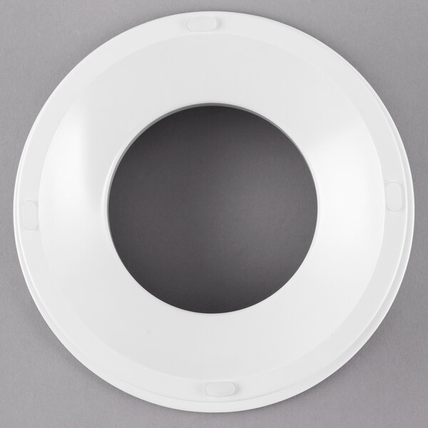 A white melamine pedestal with a circular hole on top.