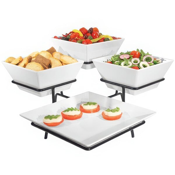 A black Cal-Mil organizer display with a white square platter and three white square bowls of food.