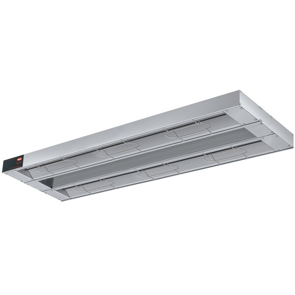 A Hatco stainless steel infrared warmer with light fixtures and red toggle buttons.