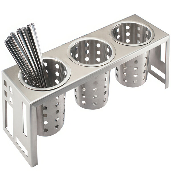 A stainless steel horizontal container with three cylinders with utensils in them.