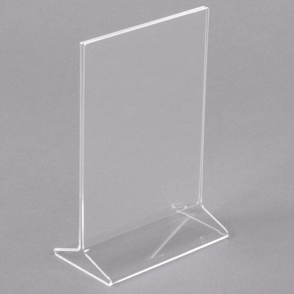 A clear plastic stand for displaying menus.