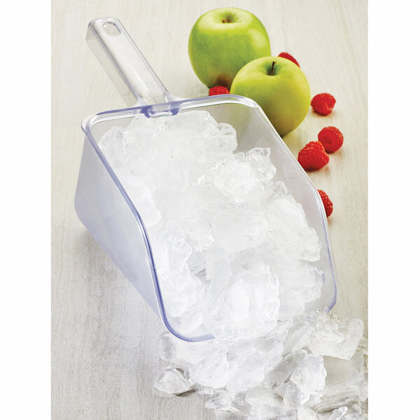 A Cal-Mil Classic polycarbonate scoop filled with ice on a table.