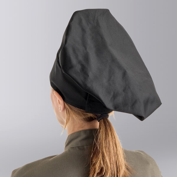 A woman wearing a black Choice chef hat.