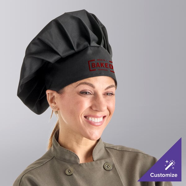A woman wearing a Choice black customizable chef hat.