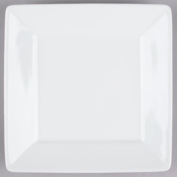 A Tuxton TuxTrendz Santorini bright white square china plate with a white rim.