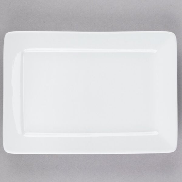 A white rectangular Tuxton china plate with a white border.
