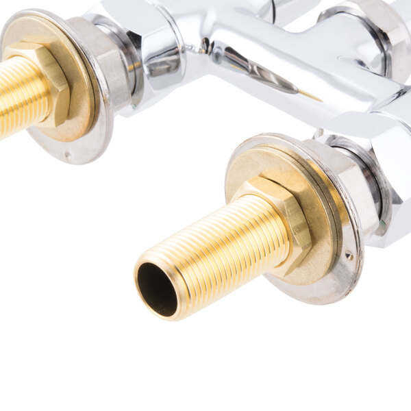 A close up of an Equip by T&amp;S deck mount swing faucet with metal pipes.