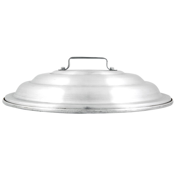 A silver Town aluminum steamer cover with a handle.