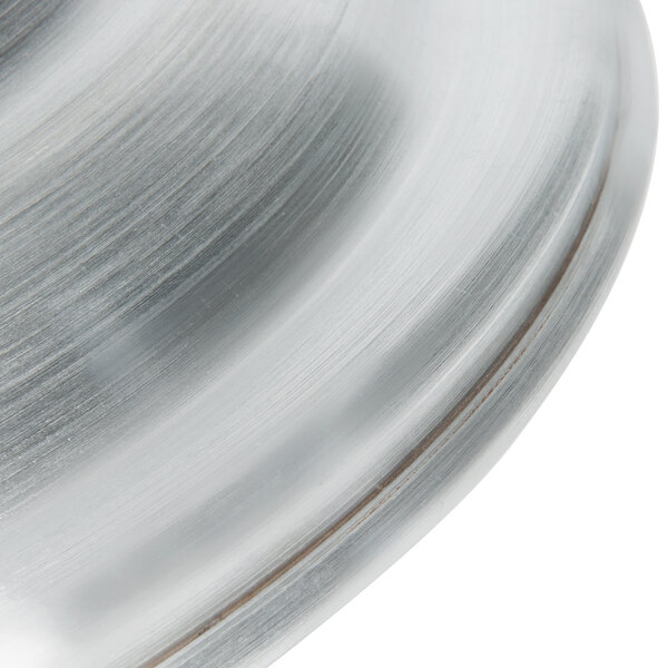 An aluminum steamer cover with a white background.