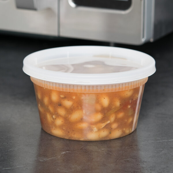 A plastic container of beans.