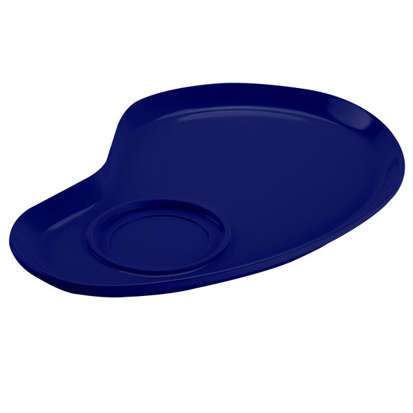 A cobalt blue melamine plate with a circle in the middle.